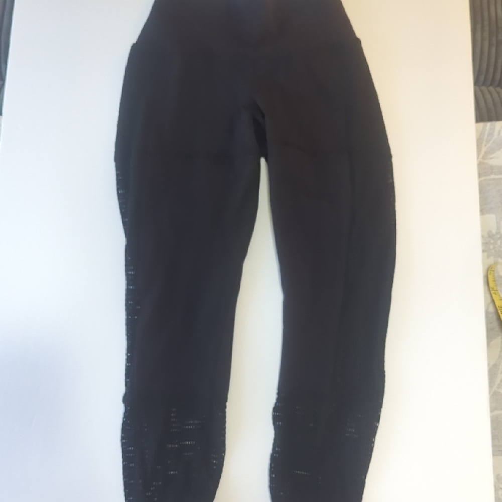 ALO Yoga Black Leggings With Netting On Sides And Bottom Of Legs